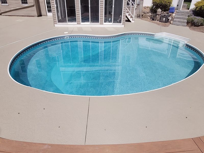 Stamped concrete overlay pool deck restoration