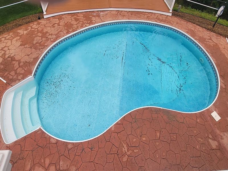 Stamped concrete resurfacing around pool