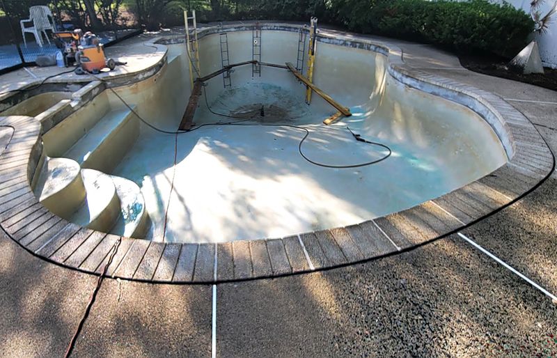 Pool deck resurfacing with polymer concrete overlay Massachusetts