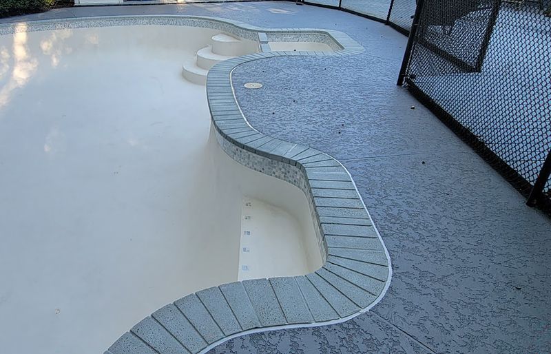 Pool deck restoration with polymer concrete coating