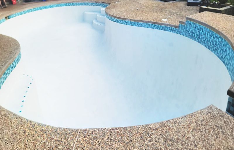 Porcelain waterline tile set on Connecticut pool renovation