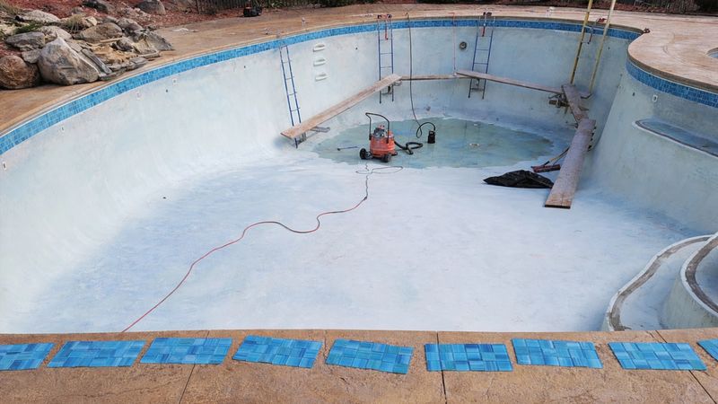 Ceramic tile waterline band pool renovation Massachusetts