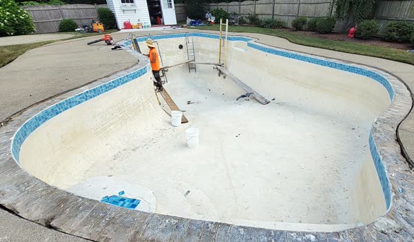 Crew beginning pool renovation work