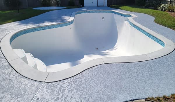 Pool shell freshly plastered, new deck resurfaced