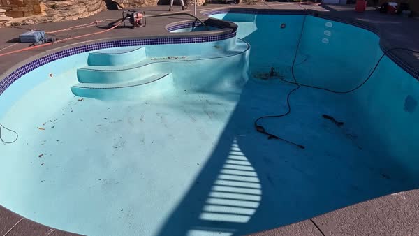 Before: Pool with old deteriorating plaster and steps