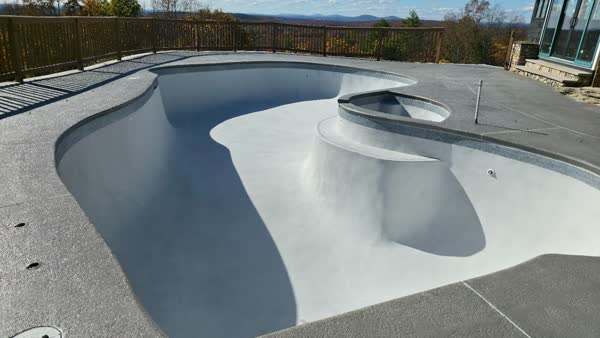 Pool completed with beautiful blue tile and stamped deck