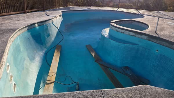 Hilltop pool deck resurfacing with mountain views