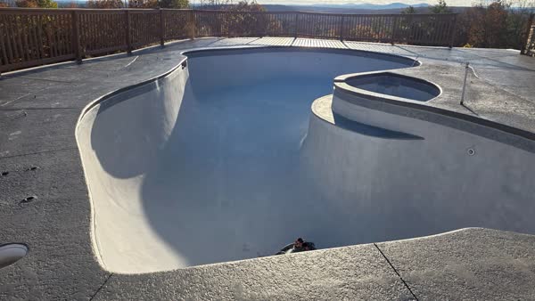 Fresh pool plaster with tile and bench detail