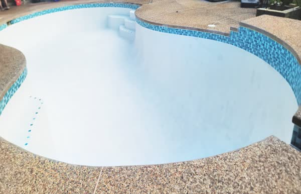 Finished pool with new plaster and tile