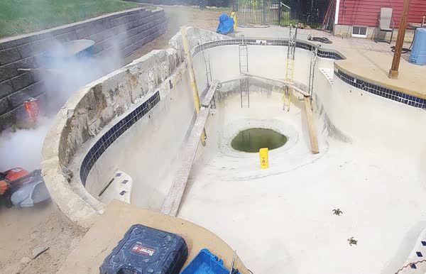 Before: Green water and crumbling walls