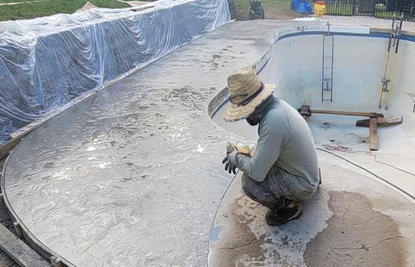 Finished pool with stamped decorative deck