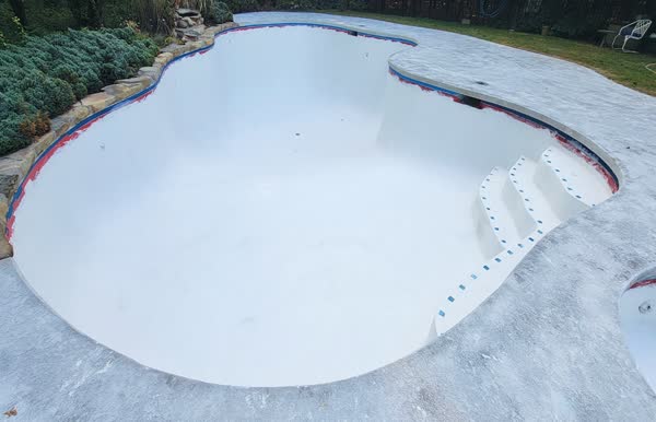 After: Pool filled with crystal clear water