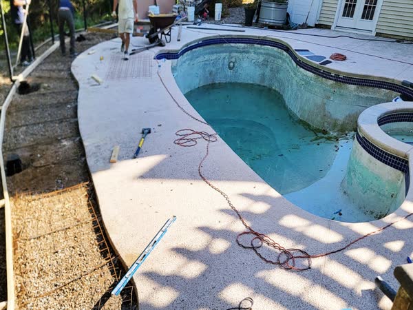 Crew working on pool and deck